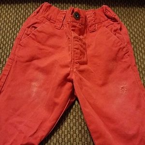Red distressed skinny pants